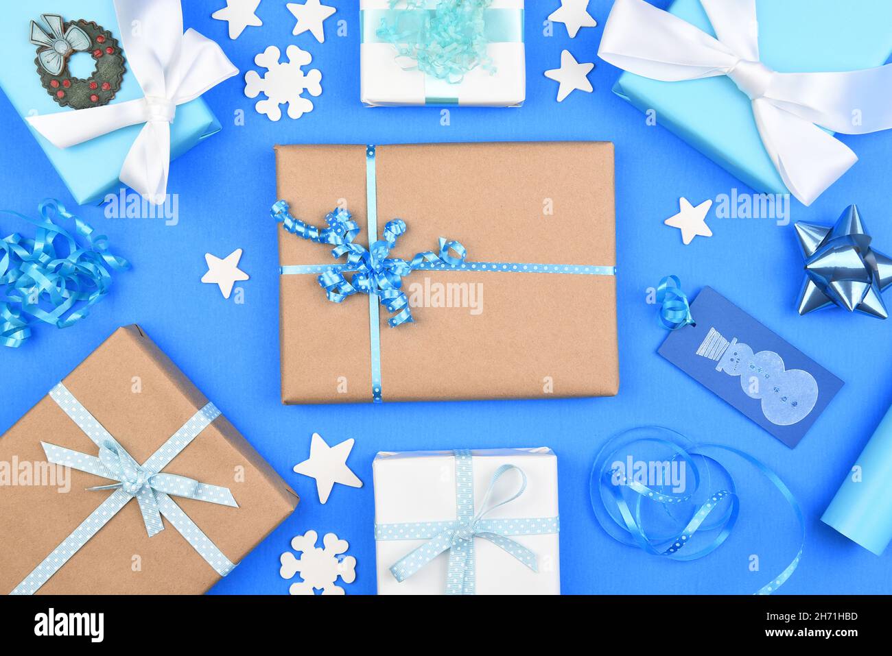 Christmas holiday flat lay composition filling the frame on a blue background. Stock Photo