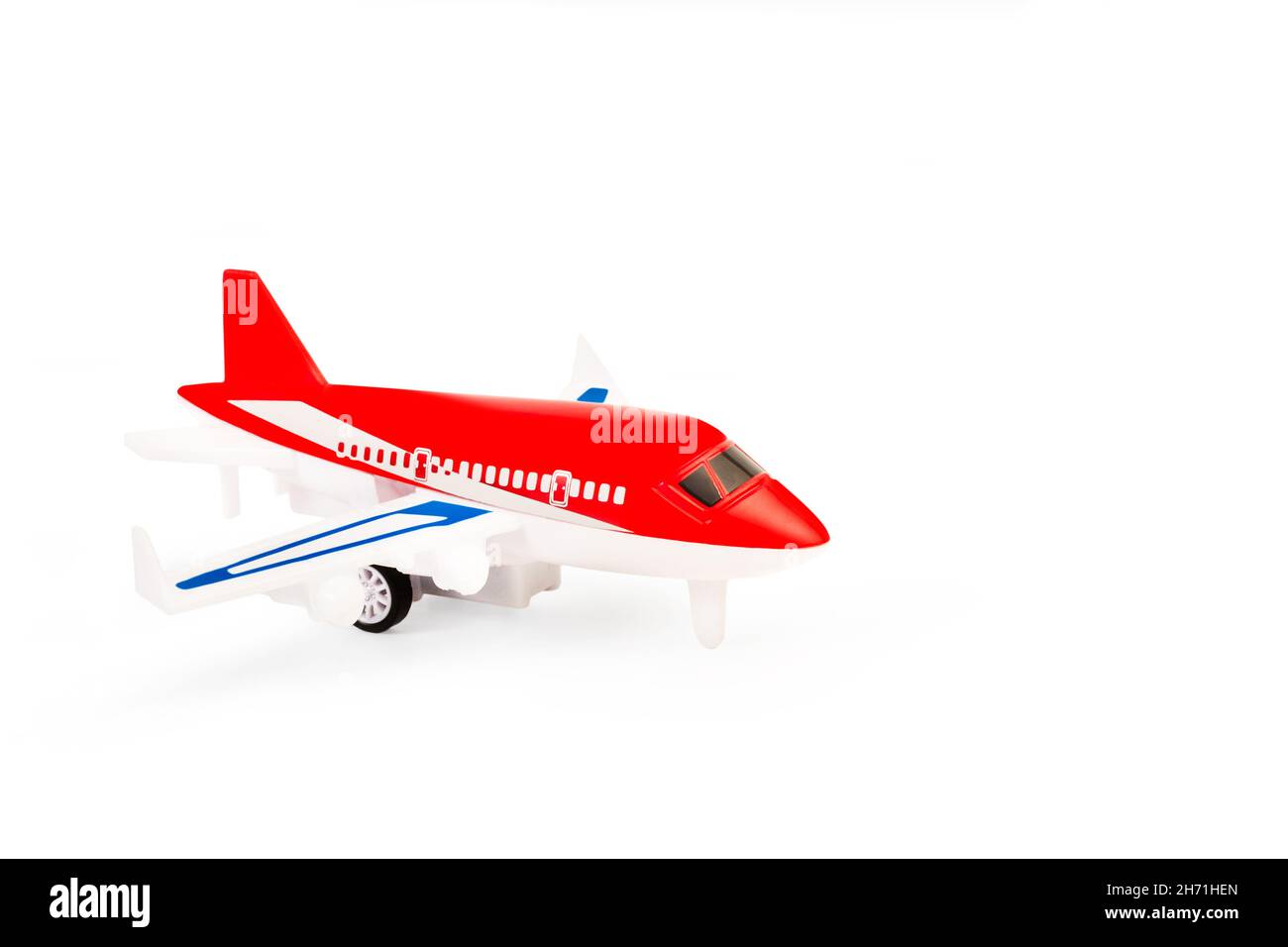 A red toy plane on a white background with copy space Stock Photo - Alamy