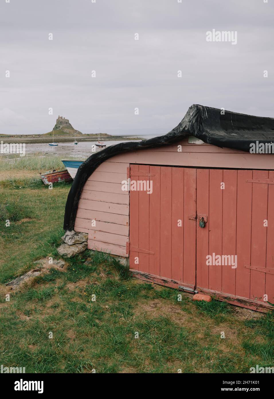 The upturned Herring fishing boat hulls used as sheds or huts on Holy