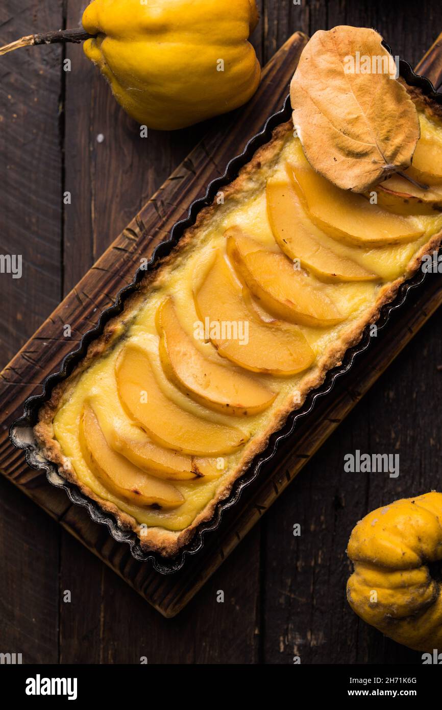 quince tart with custard open and shortcrust pastry and cinnamon. Stock Photo