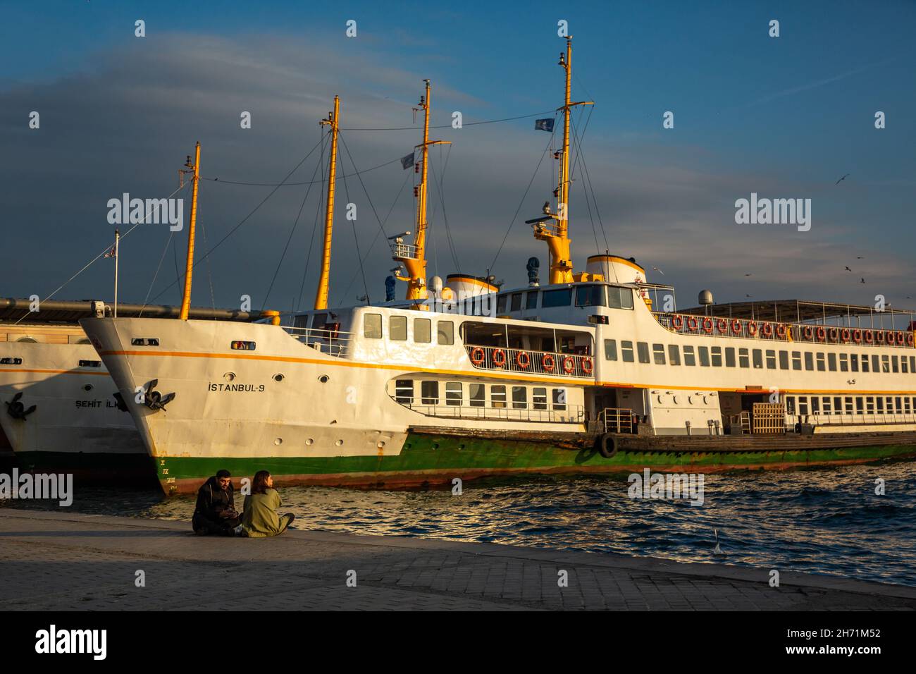Traditional passenger ships of Istanbul city moored in famous Karakoy pier and wait for the departure time, Istanbul, Nov. 2019 Stock Photo