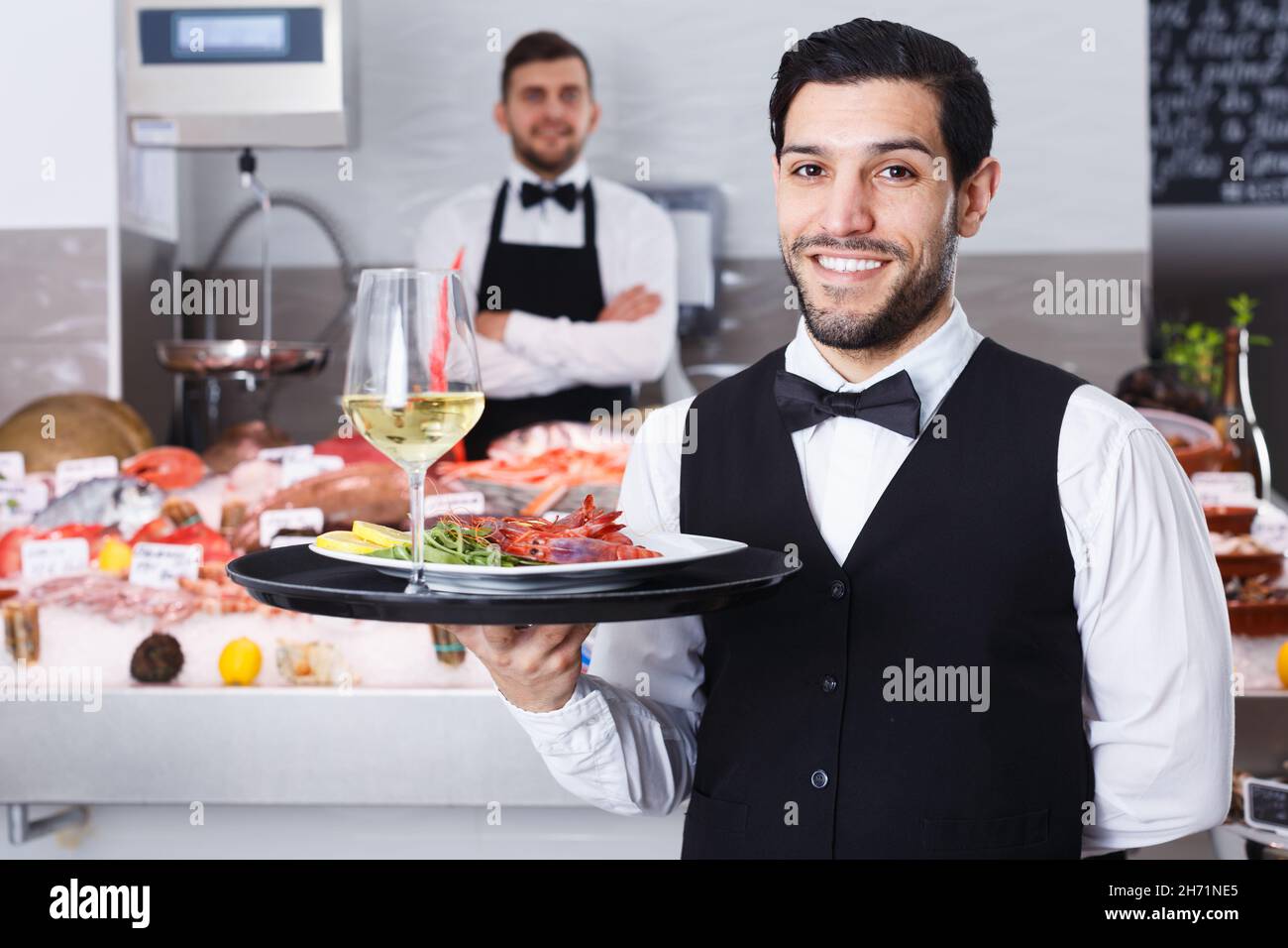 Smiling waiter posing food tray hi-res stock photography and images - Alamy