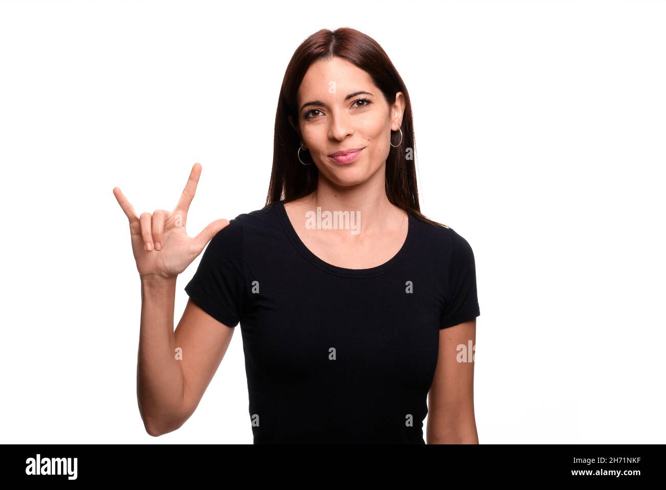 Isolated In White Background Brunette Woman Saying I Love You In Spanish Sign Language Stock Isolated in white background brunette woman saying i love you in spanish sign language stock