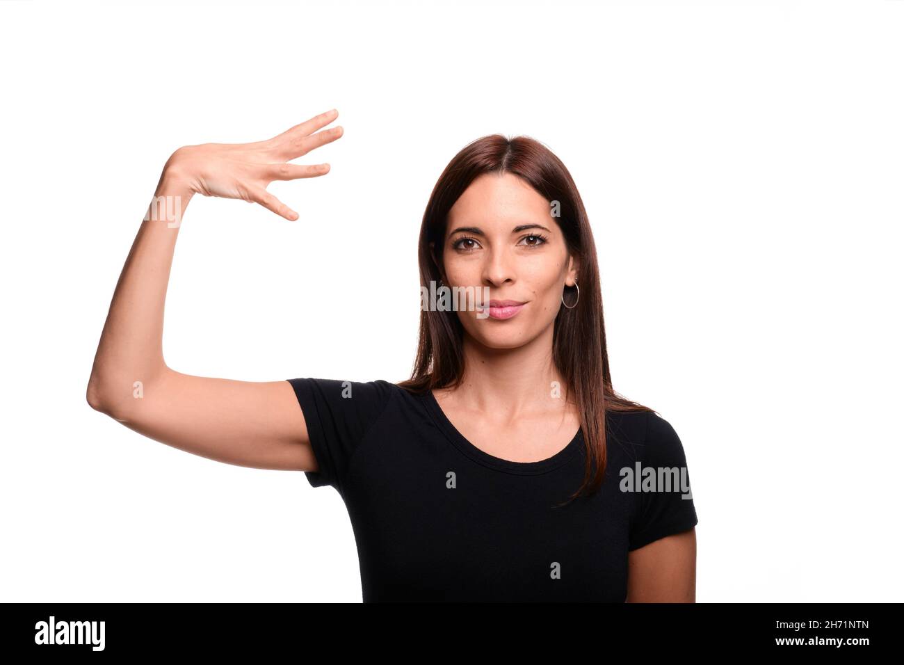 Isolated in white background woman saying sun in spanish sign