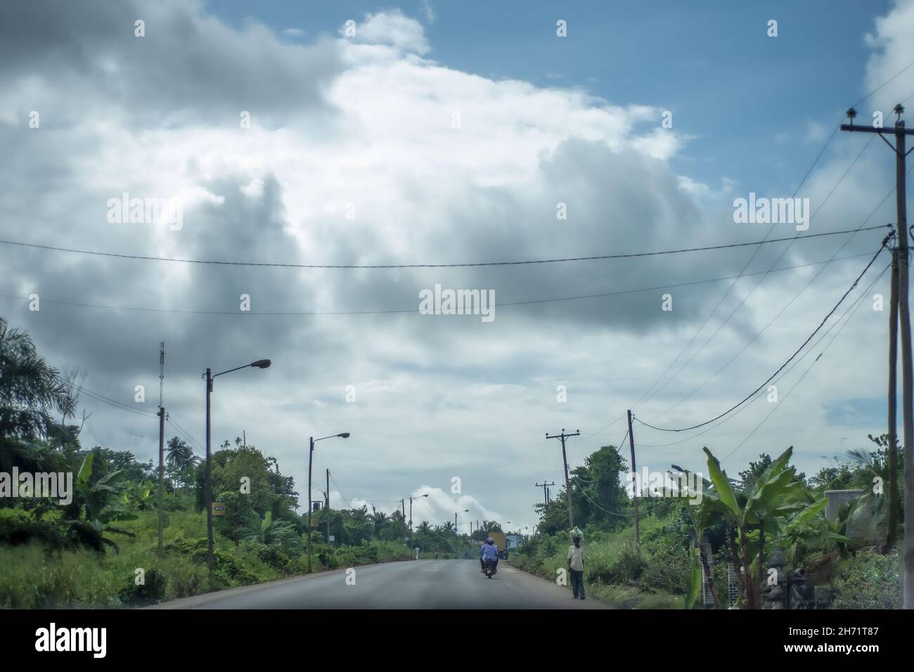 Heavy clouds over the road to Douala, Cameroon Stock Photo