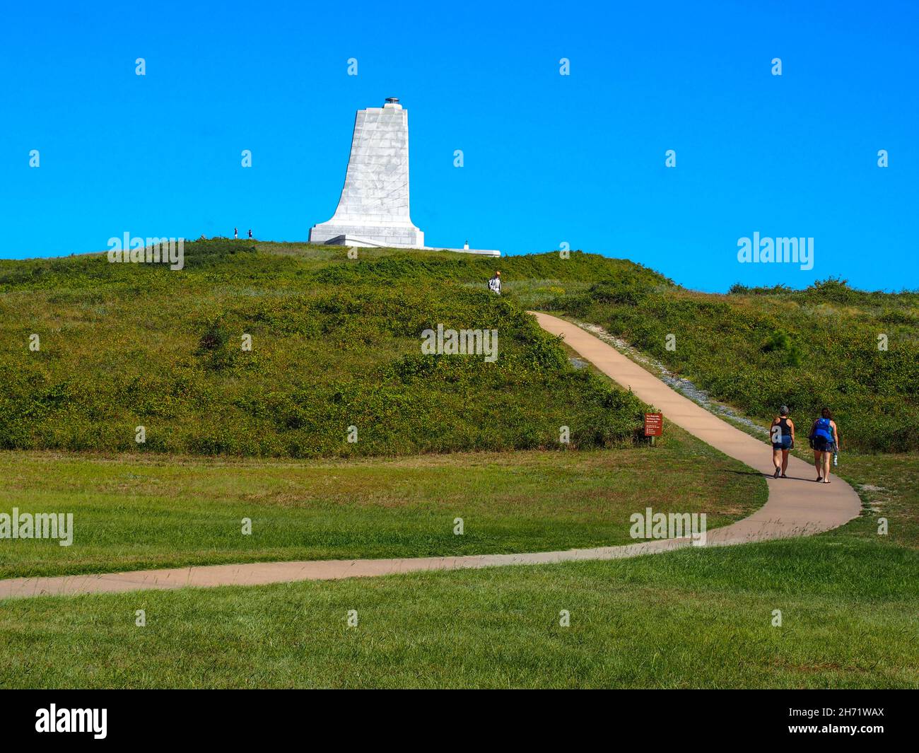 Tourists walking up the path to the Wright Brothers Monument atop Big Kill Devil Hill at the Wright Brothers National Memorial in Kill Devil Hills, No Stock Photo