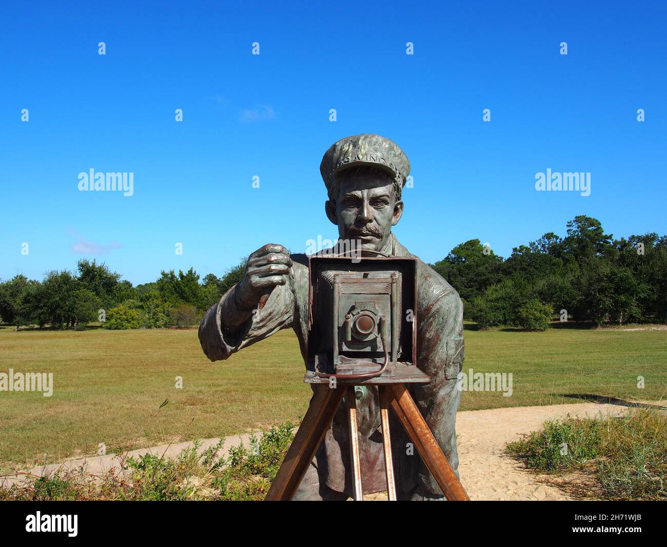 Close-up of photographer John T. Daniels on the December 17, 1903 bronze sculpture by Stephen H. Smith at the Wright Brothers National Memorial in Kil Stock Photo