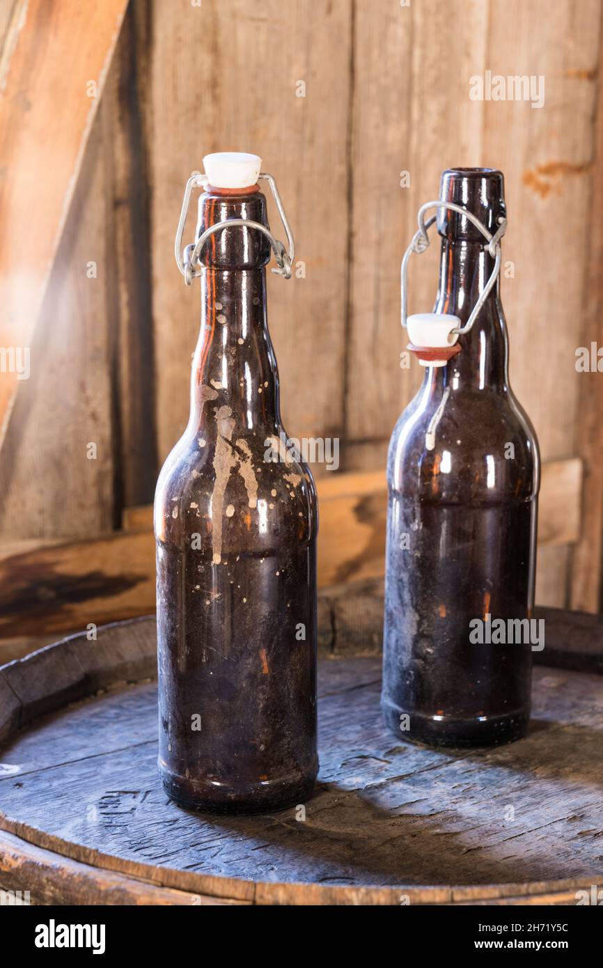 Old beer bottles on a barrel in the saloon of the old ghost town of