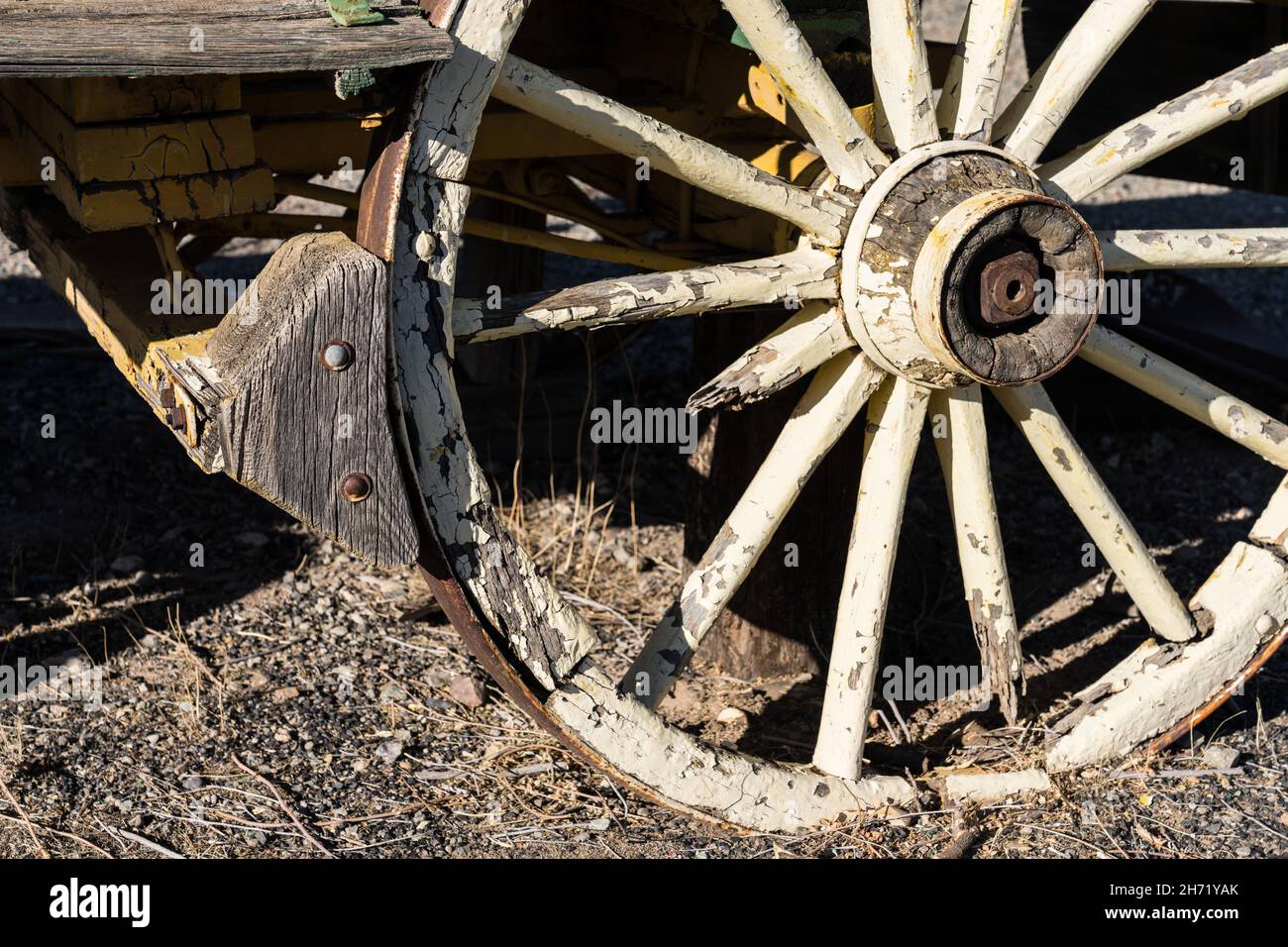 Detail of the wooden brake on an old broken down ranch wagon in the
