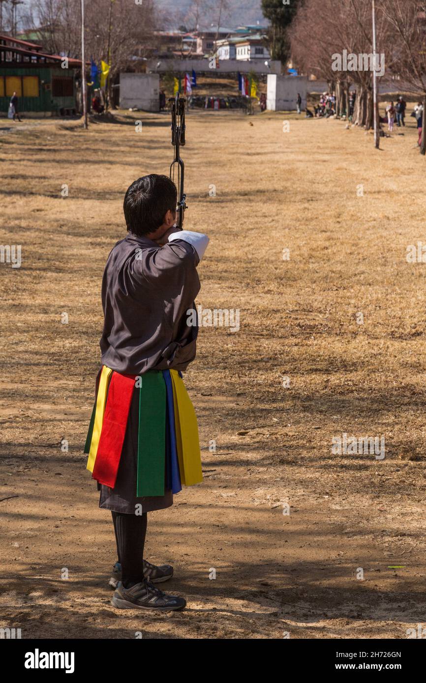 A Bhutanese archer competes with a compound bow in an archery