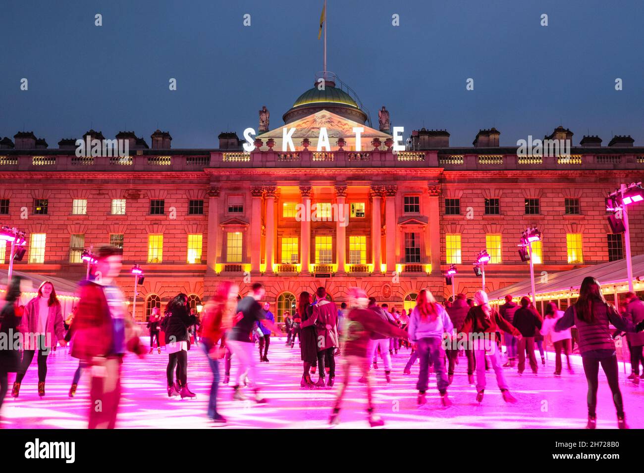 London, UK. 19th Nov, 2021. People enjoy ice skating in the courtyard ...
