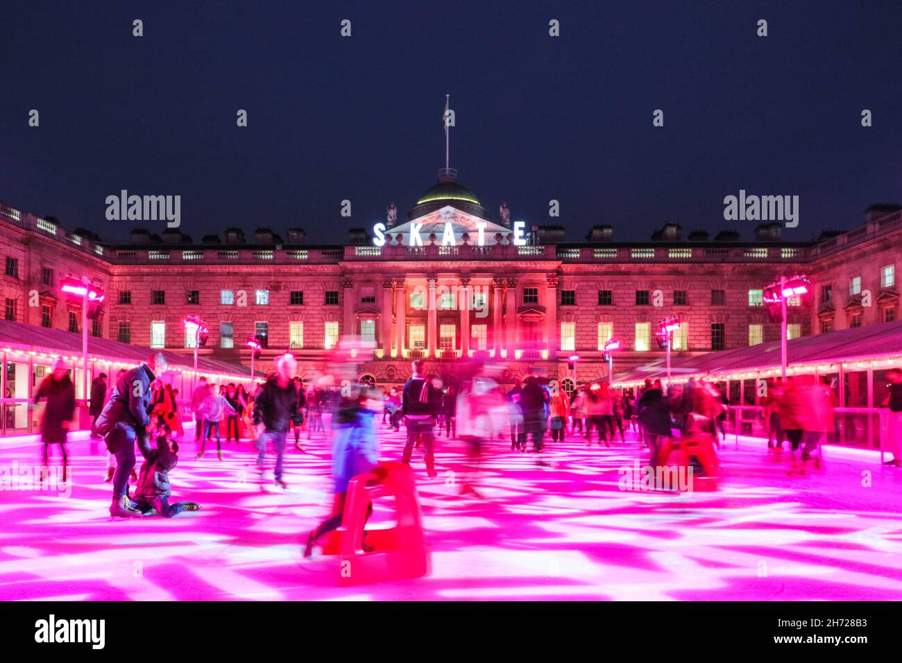 London, UK. 19th Nov, 2021. People enjoy ice skating in the courtyard ...