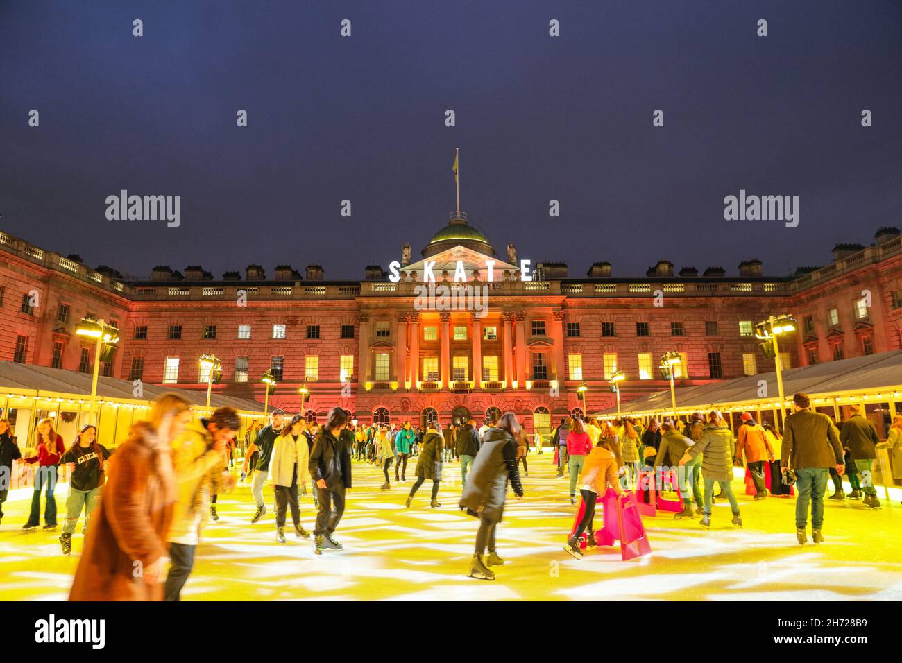 London, UK. 19th Nov, 2021. People enjoy ice skating in the courtyard ...