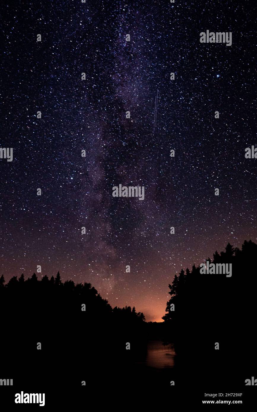 Vertical shot of a sky with shiny stars during late sunset Stock Photo ...