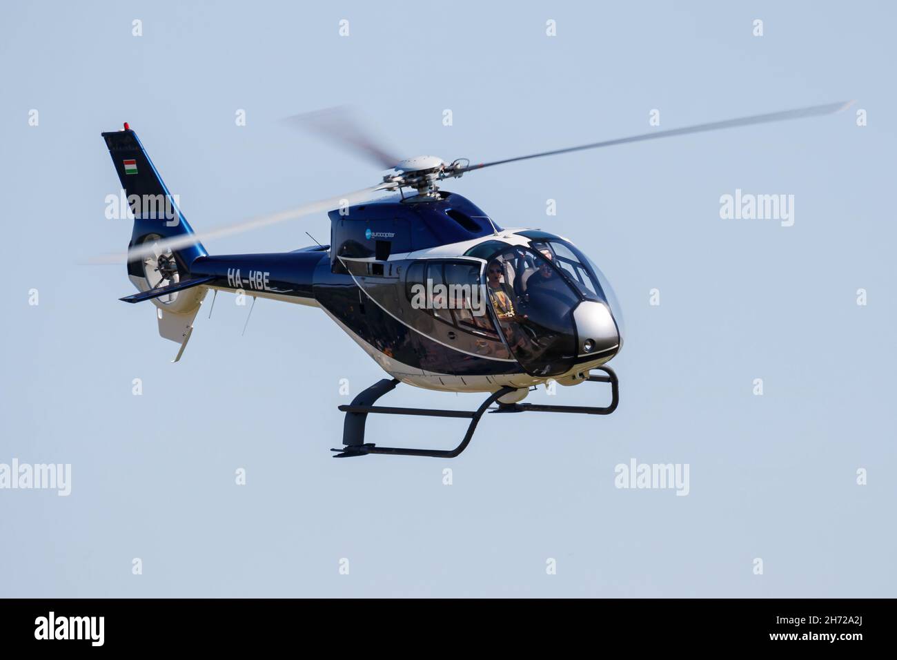 Kaposujlak, Hungary - June 5, 2021: Commercial helicopter at airport and airfield. Rotorcraft. General aviation industry. Civil utility transportation Stock Photo