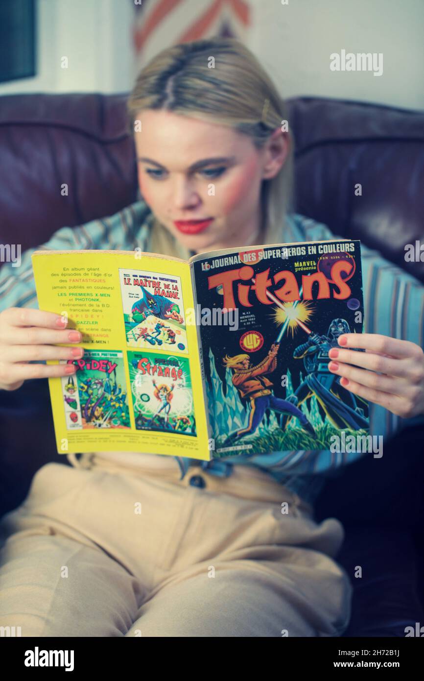 Girl reading a comic book Stock Photo