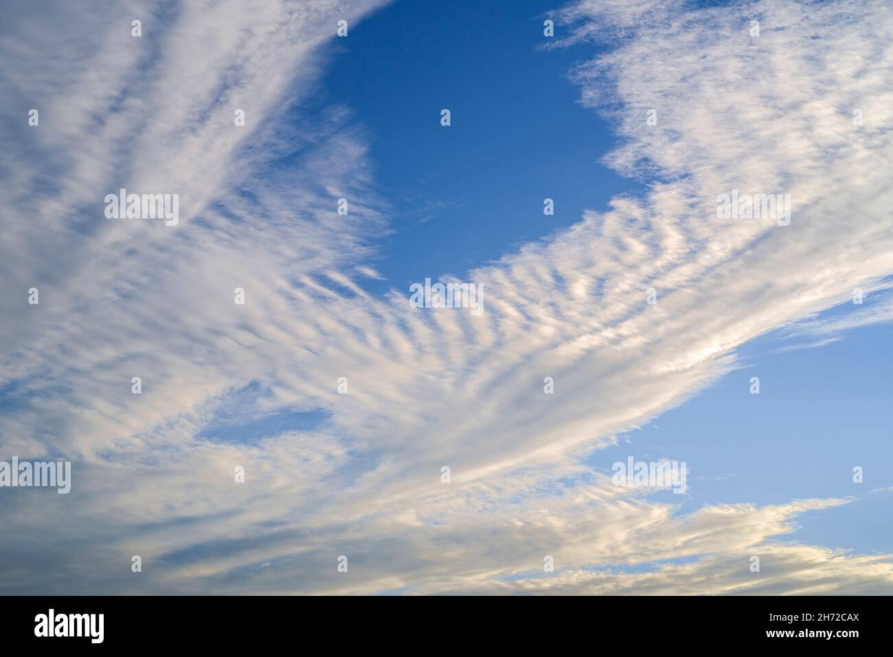 Altocumulus stratiformis undulatus middle-altitude cloud formation Stock Photo