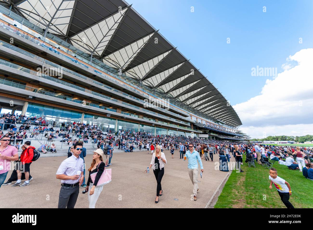 Grandstand at Royal Ascot racecourse, Royal Berkshire, UK, during the Red Bull Air Race. Public visitors below the stand Stock Photo