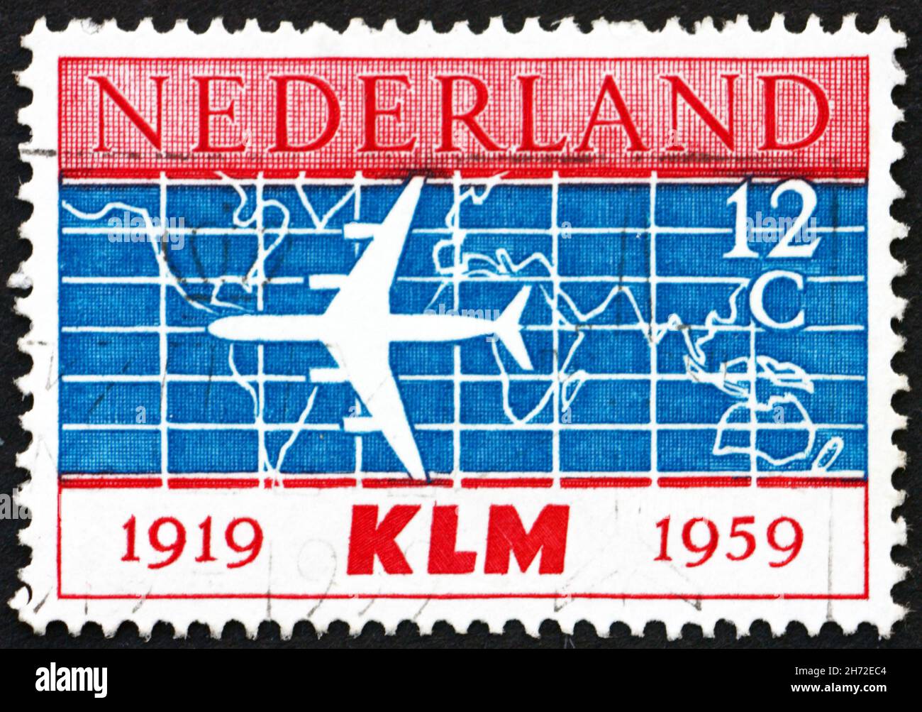 NETHERLANDS - CIRCA 1959: a stamp printed in the Netherlands shows Douglas DC-8 and World Map, 40th Anniversary of the Founding of KLM, Royal Dutch Ai Stock Photo