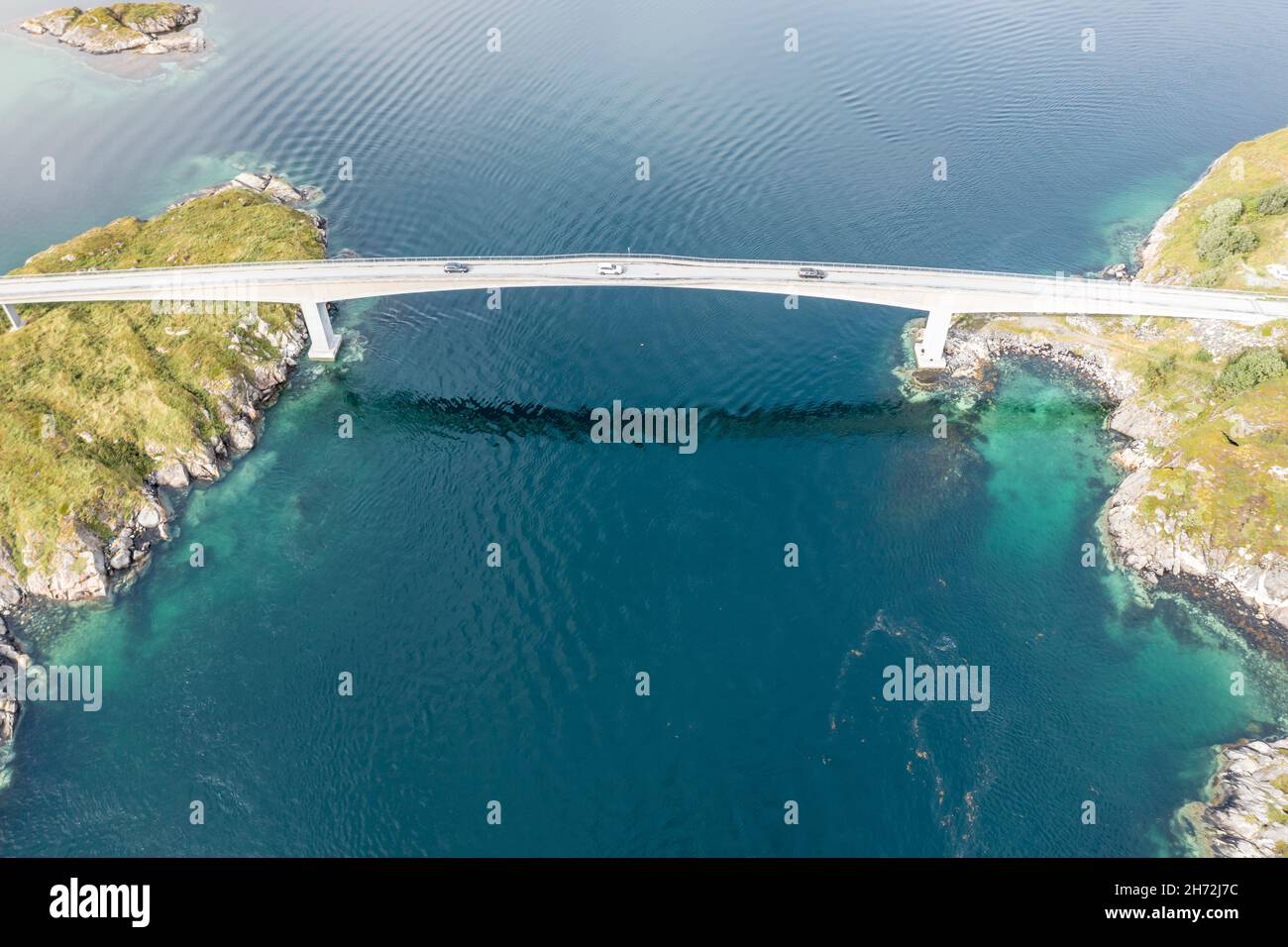 Aerial view of bridge connecting islands at the norwegian coast, cars on the one lane bridge, Norway Stock Photo