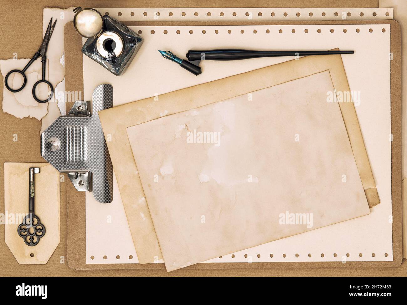 Aged vintage paper and stationery writing tools. Flat lay retro Stock Photo
