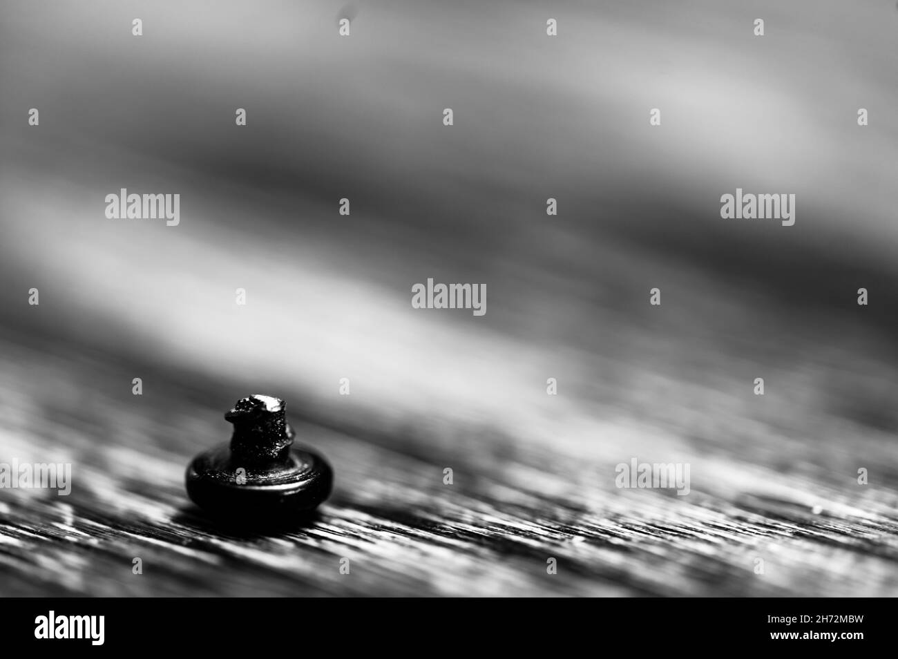 bolt head turned over to show sheared threading after stress failure