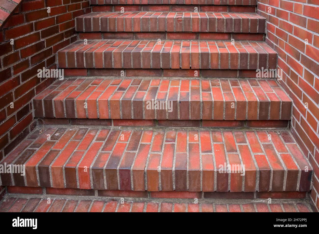 Red stairs made of bricks toward somewhere Stock Photo