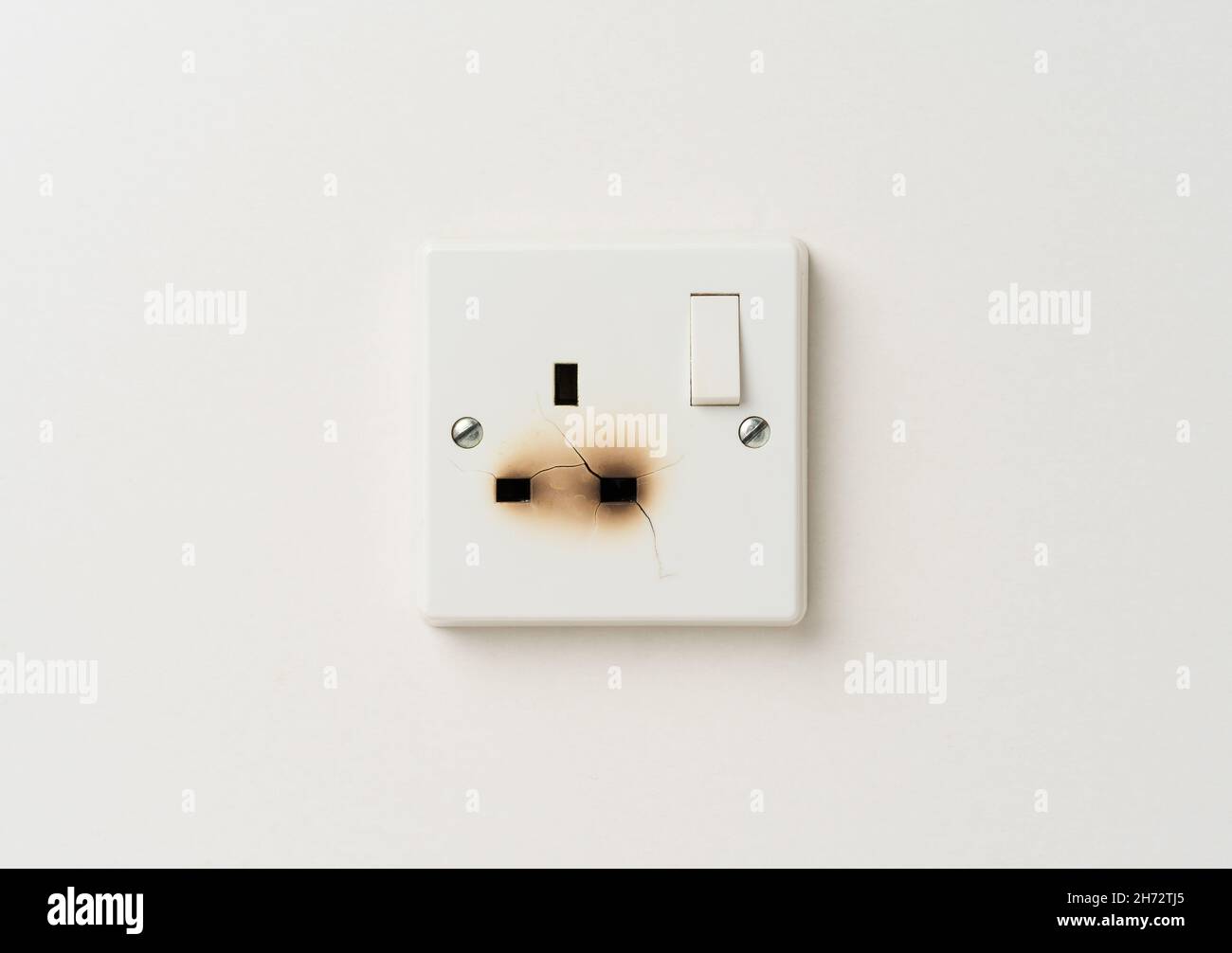 Damaged electrical domestic power socket with cracks and burn marks Stock Photo Alamy