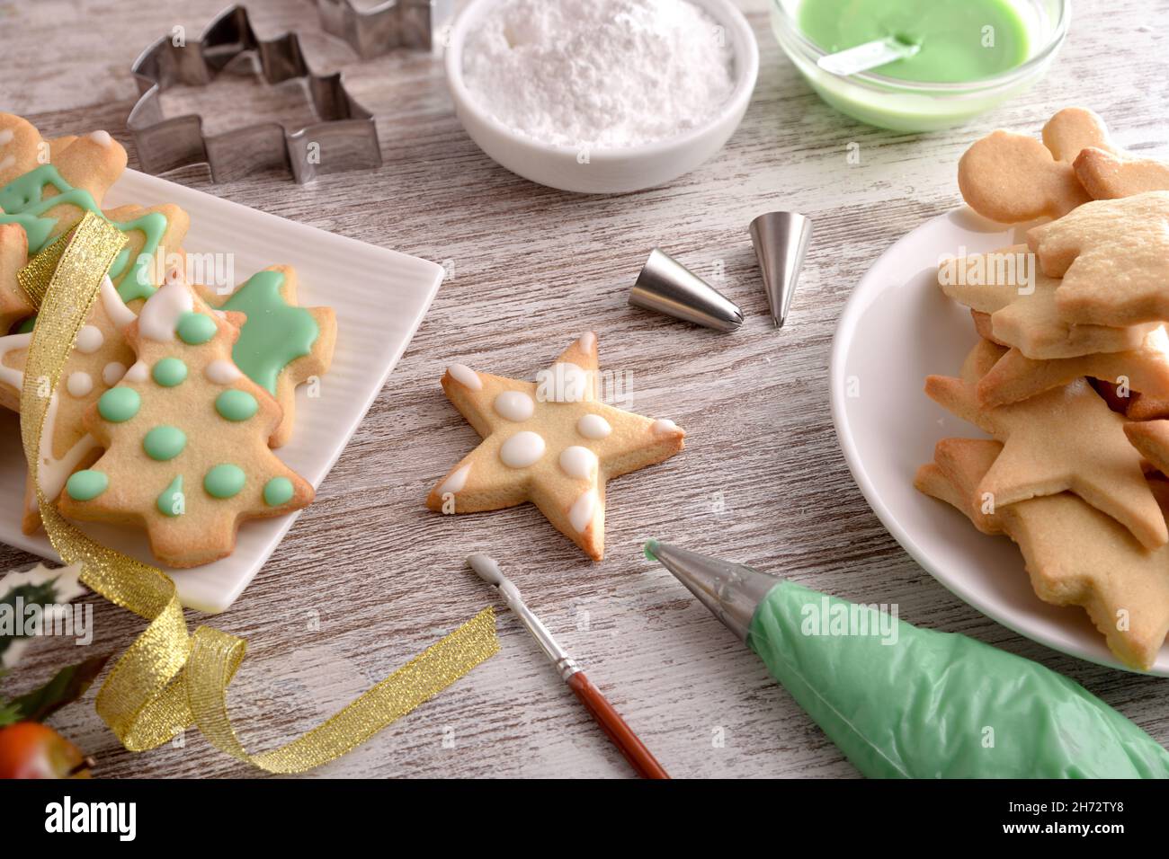 Tools for painting Christmas cookies with icing close up. Elevated view. Horizontal composition. Stock Photo