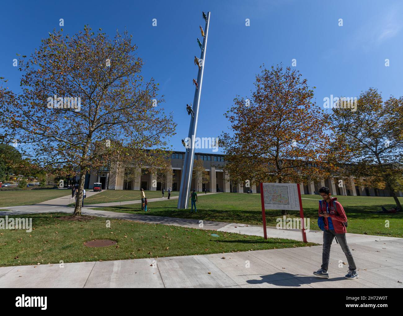 The Walking to the Sky Sculpture at Carnegie Mellon University on a Sunny Day. Walking to the Sky is a public sculpture by Jonathan Borofsky Stock Photo