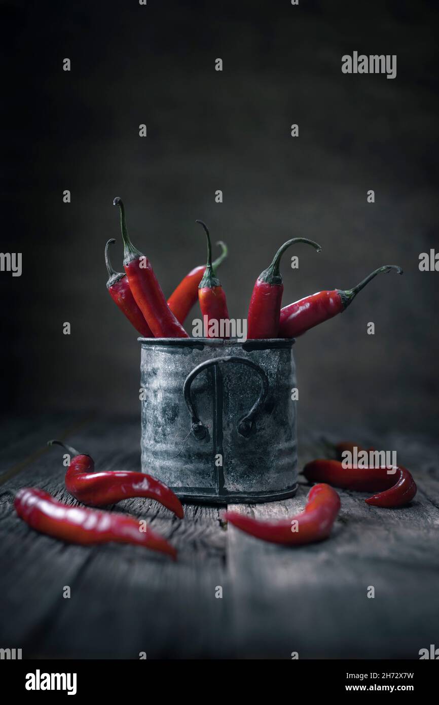 Red hot chily peper, still life in an old mug Stock Photo - Alamy