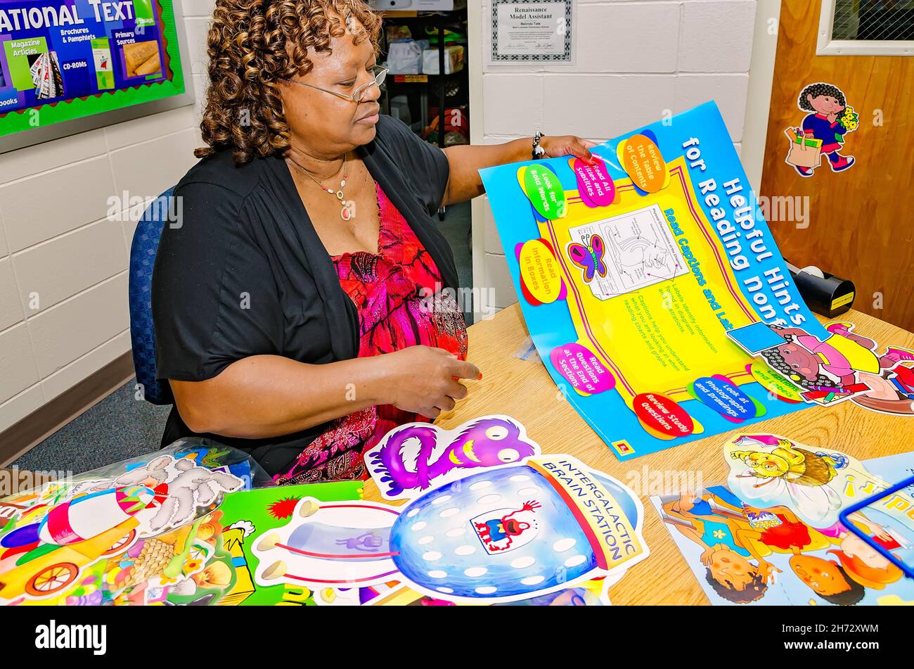 Teacher making bulletin board hires stock photography and images Alamy