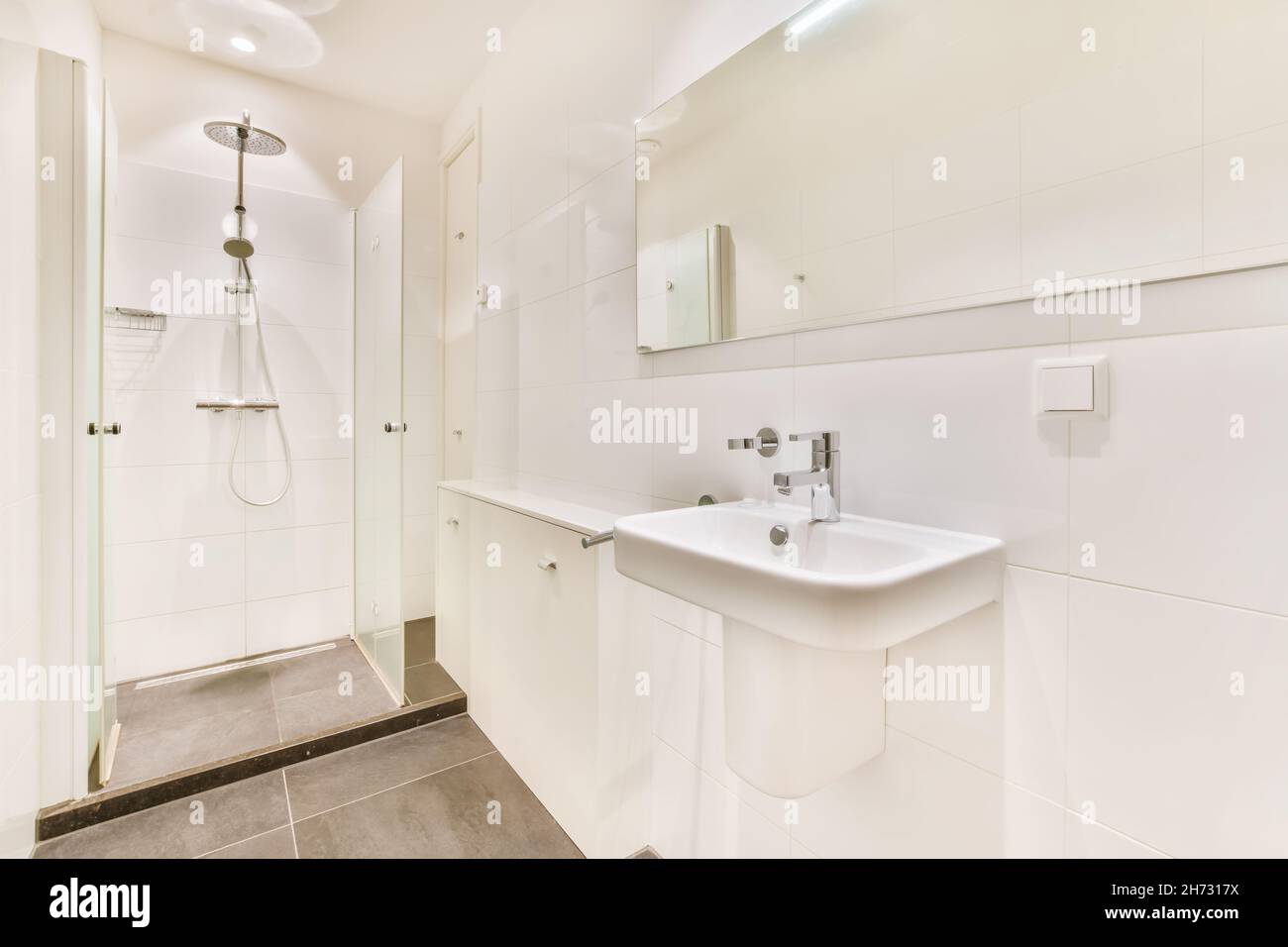 Shower room design with extra large mirror stock photo alamy