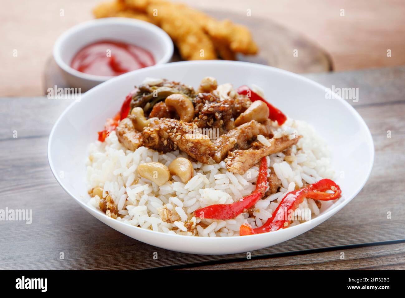 Teriyaki chicken with rice, bell pepper and sesame Stock Photo Alamy
