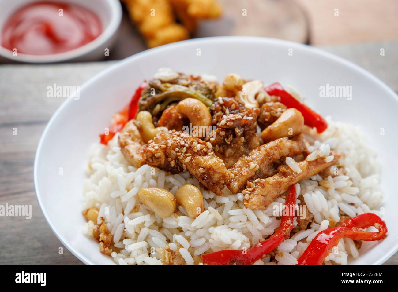 Teriyaki chicken with rice, bell pepper and sesame Stock Photo Alamy
