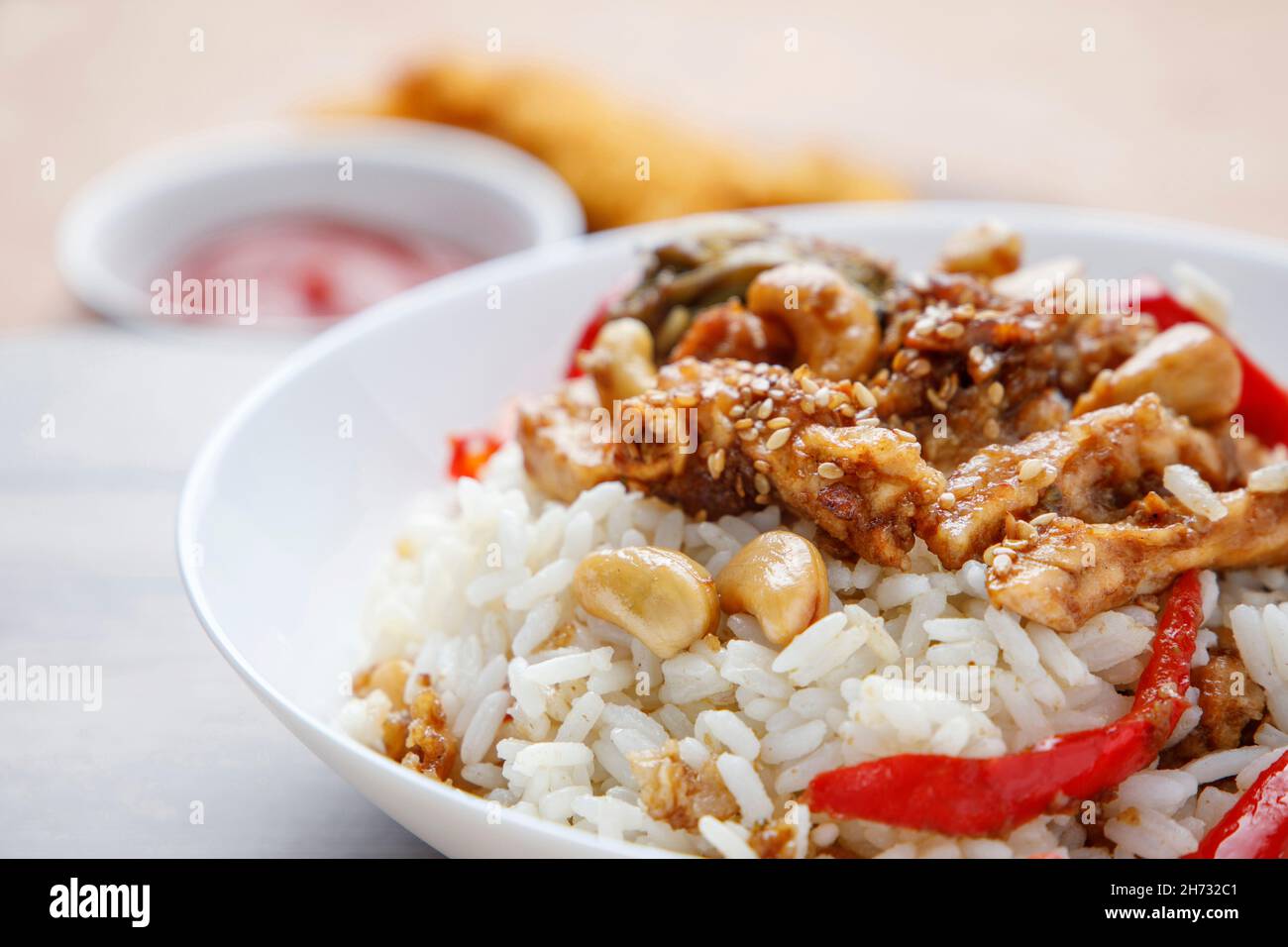 Teriyaki chicken with rice, bell pepper and sesame Stock Photo Alamy