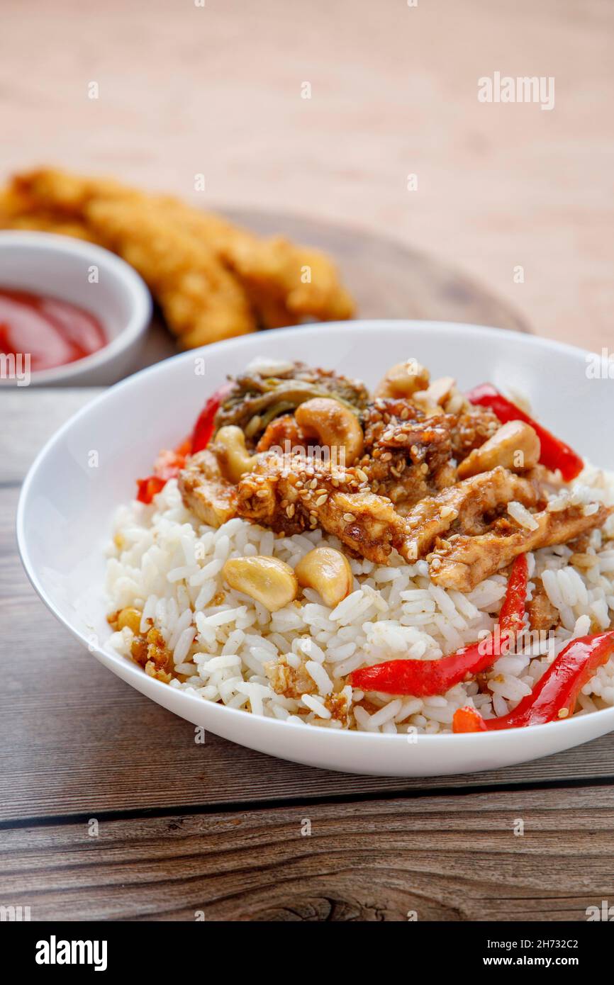 Teriyaki chicken with rice, bell pepper and sesame Stock Photo Alamy