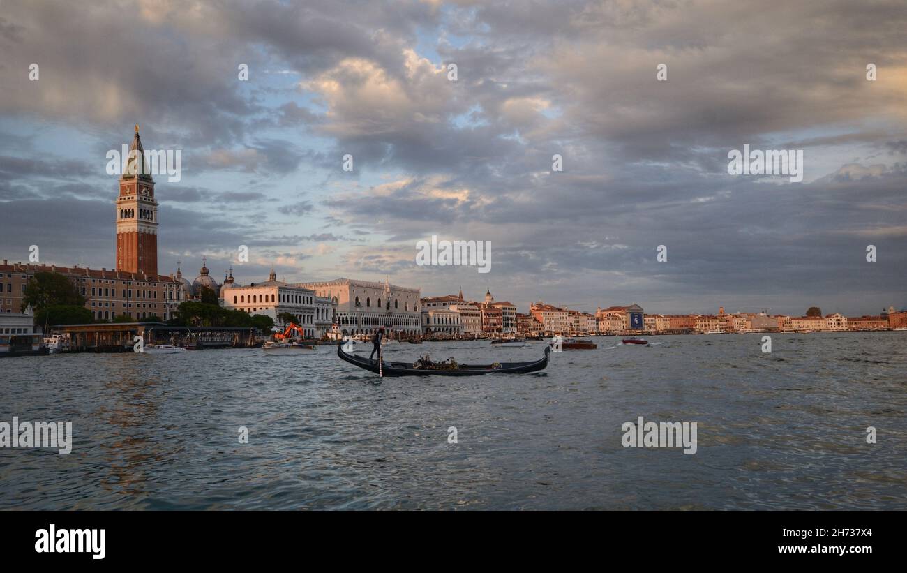Gondola in the lagoon and the main view of Venice, Italy Stock Photo ...
