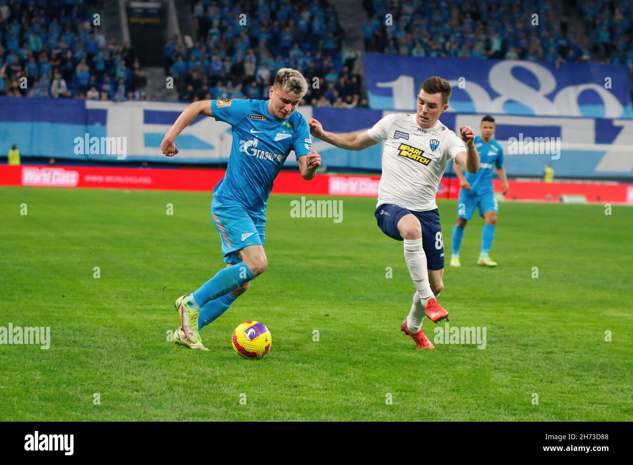 Saint Petersburg, Russia. 19th Nov, 2021. Andrey Mostovoy (L) of Zenit and Ilya Berkovsky (R) of Nizhny Novgorod are seen in action during the Russian Premier League football match between Zenit Saint Petersburg and Nizhny Novgorod at Gazprom Arena.Final score; Zenit 5:1 Nizhny Novgorod. Credit: SOPA Images Limited/Alamy Live News Stock Photo