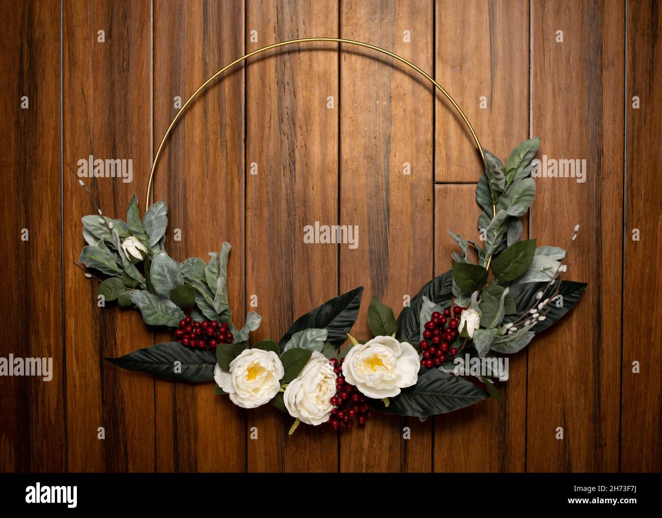 Modern Christmas Wreath on wood background with cranberries Stock Photo