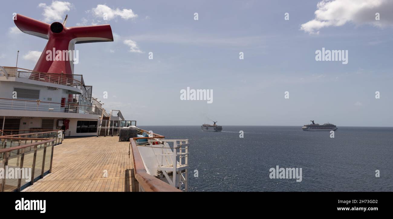 Saint Vincent and the Grenadines - May 8, 2020: Panoramic shot of open decks and red funnel on Carnival Freedom. Carnival Valor, Carnival Fascination, Stock Photo