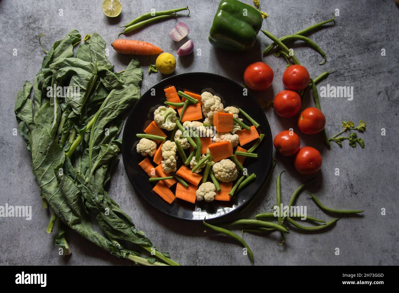 Uncooked raw vegetable ingredients on a background with use of