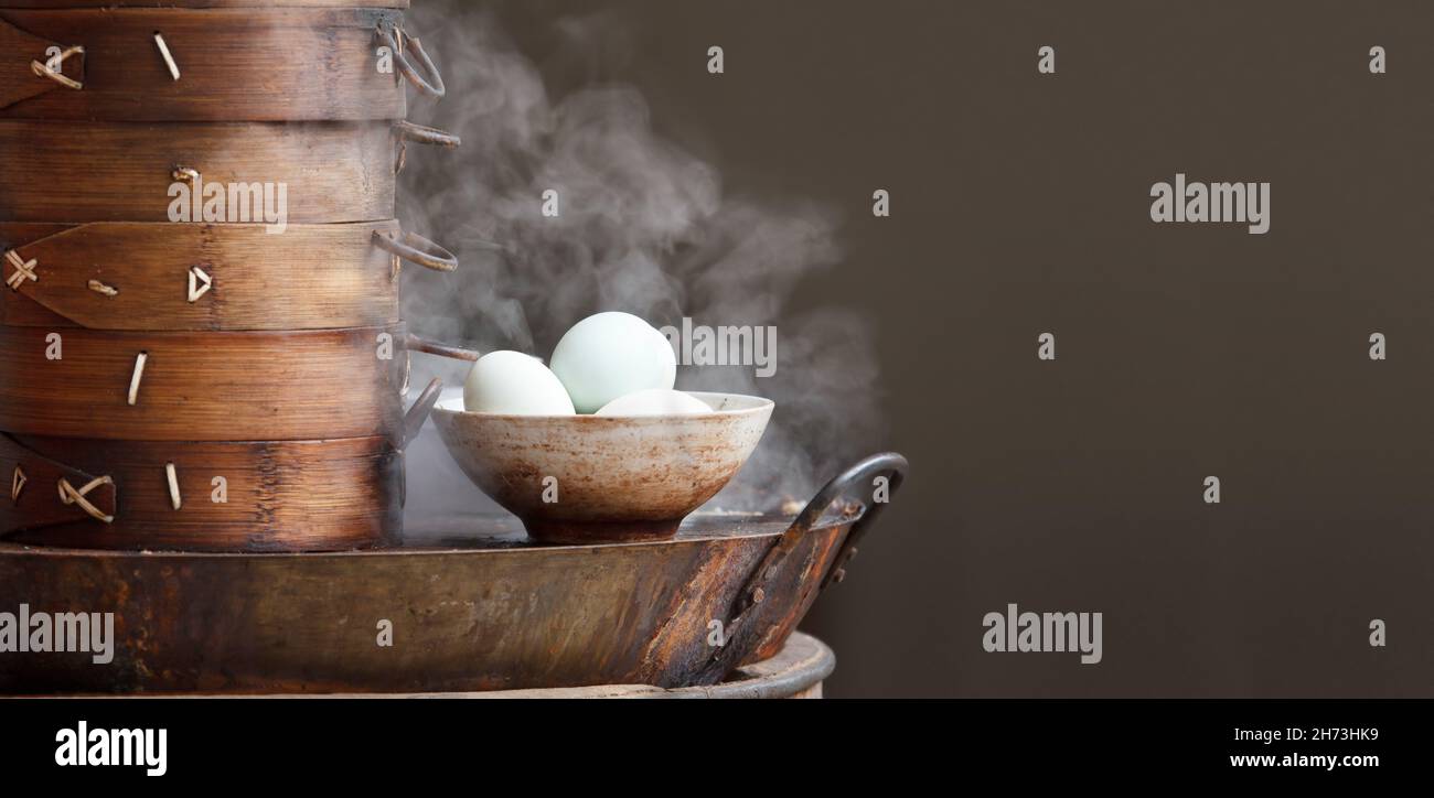 Chinese tea eggs and streamed dumpling in morning at retail outlet street food. Stock Photo