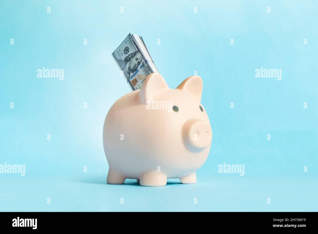 Blue piggy bank money box blue studio background Stock Photo - Alamy