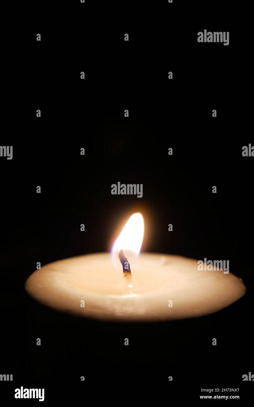 color candles slowly burning down in dark Stock Photo Alamy