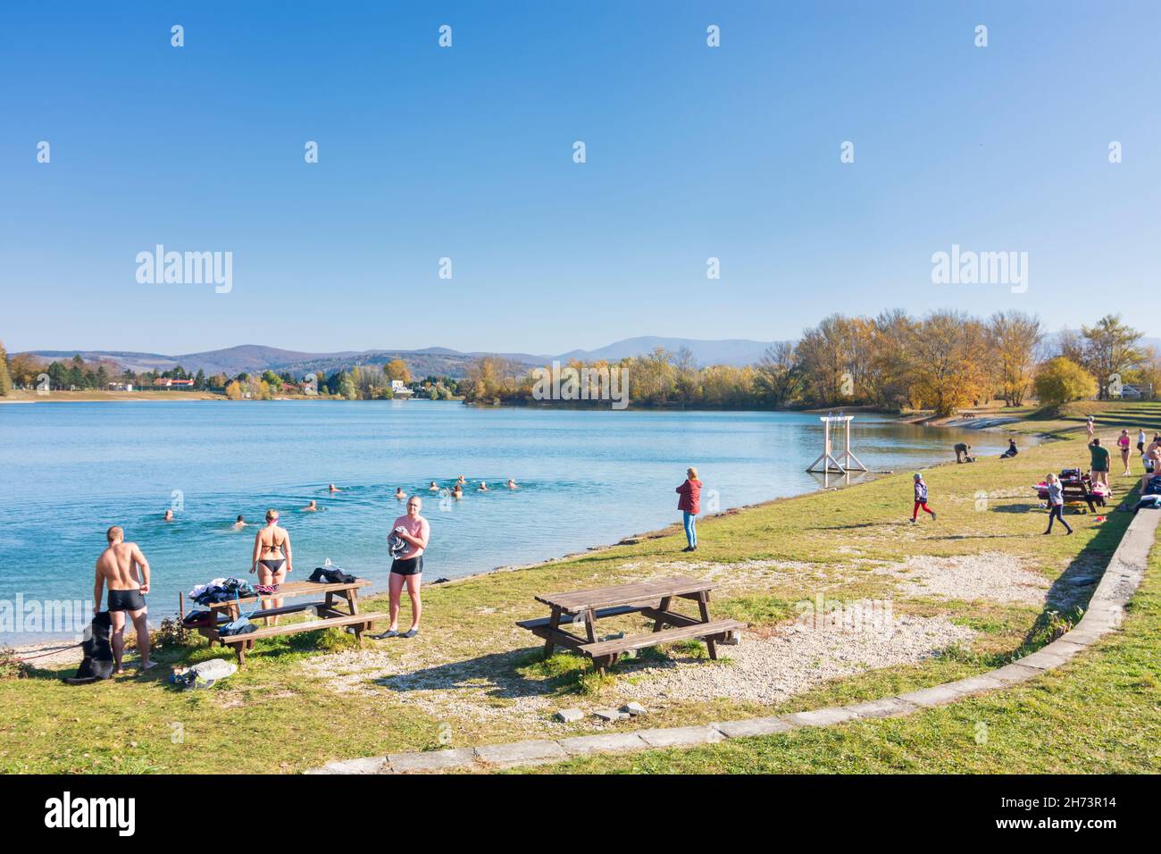 Nove Mesto nad Vahom (Neustadt an der Waag): lake Zelena voda, swimmer in cold autumn water in , , Slovakia Stock Photo