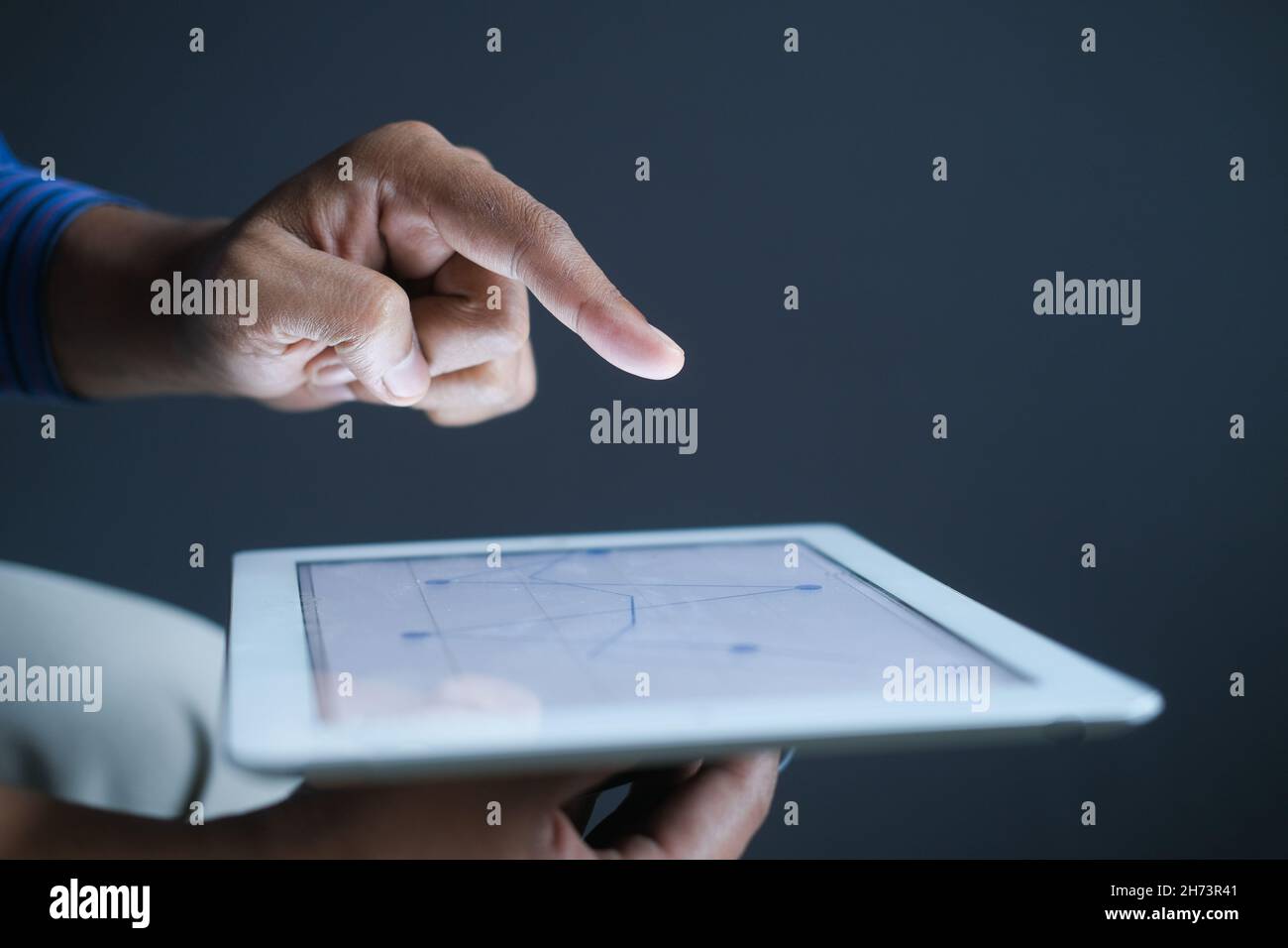 analyzing stock market data on digital tablet  Stock Photo