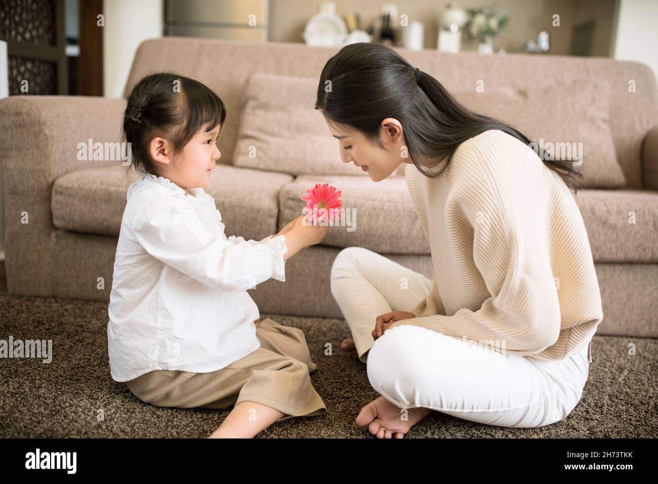 Lovely little girl sending her mother flowers Stock Photo Alamy