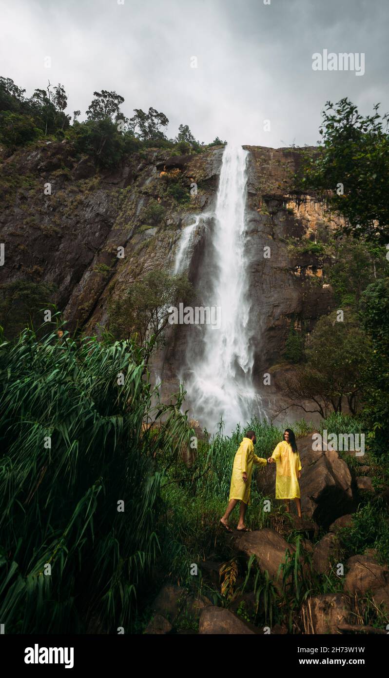 Couple in love at the waterfall. Boy and girl at the falls. Man and ...