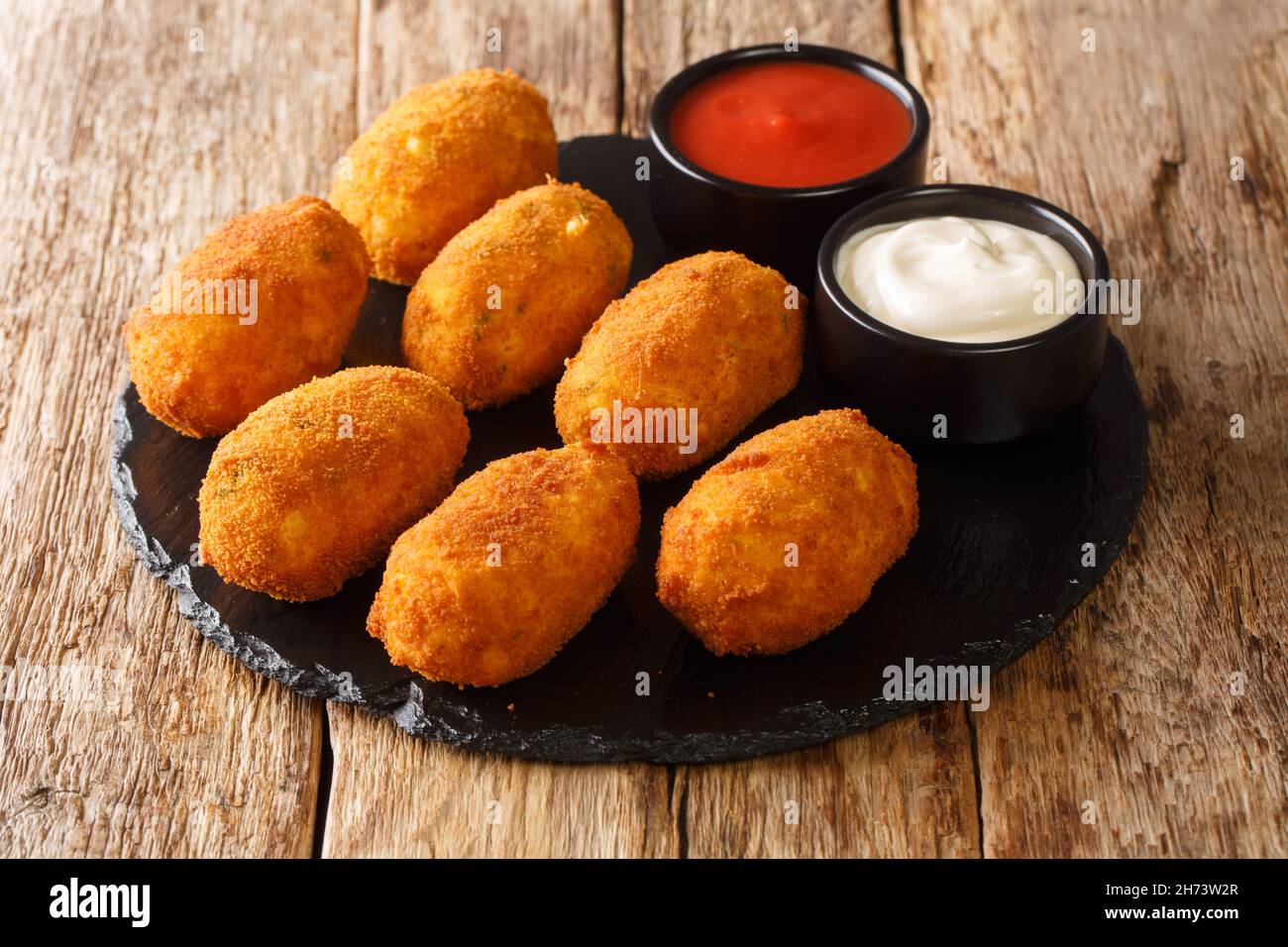Creamy Salted Cod Croquettes Croquetas De Bacalao close up in the slate